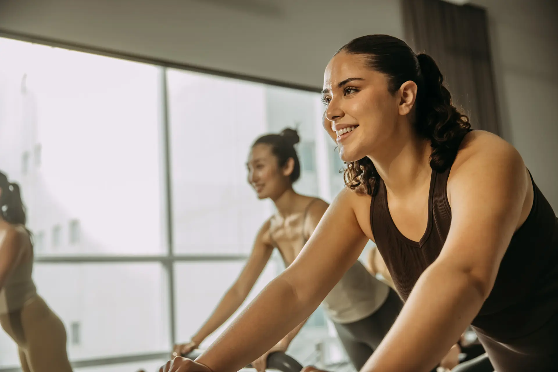 People on reformer bed holding position