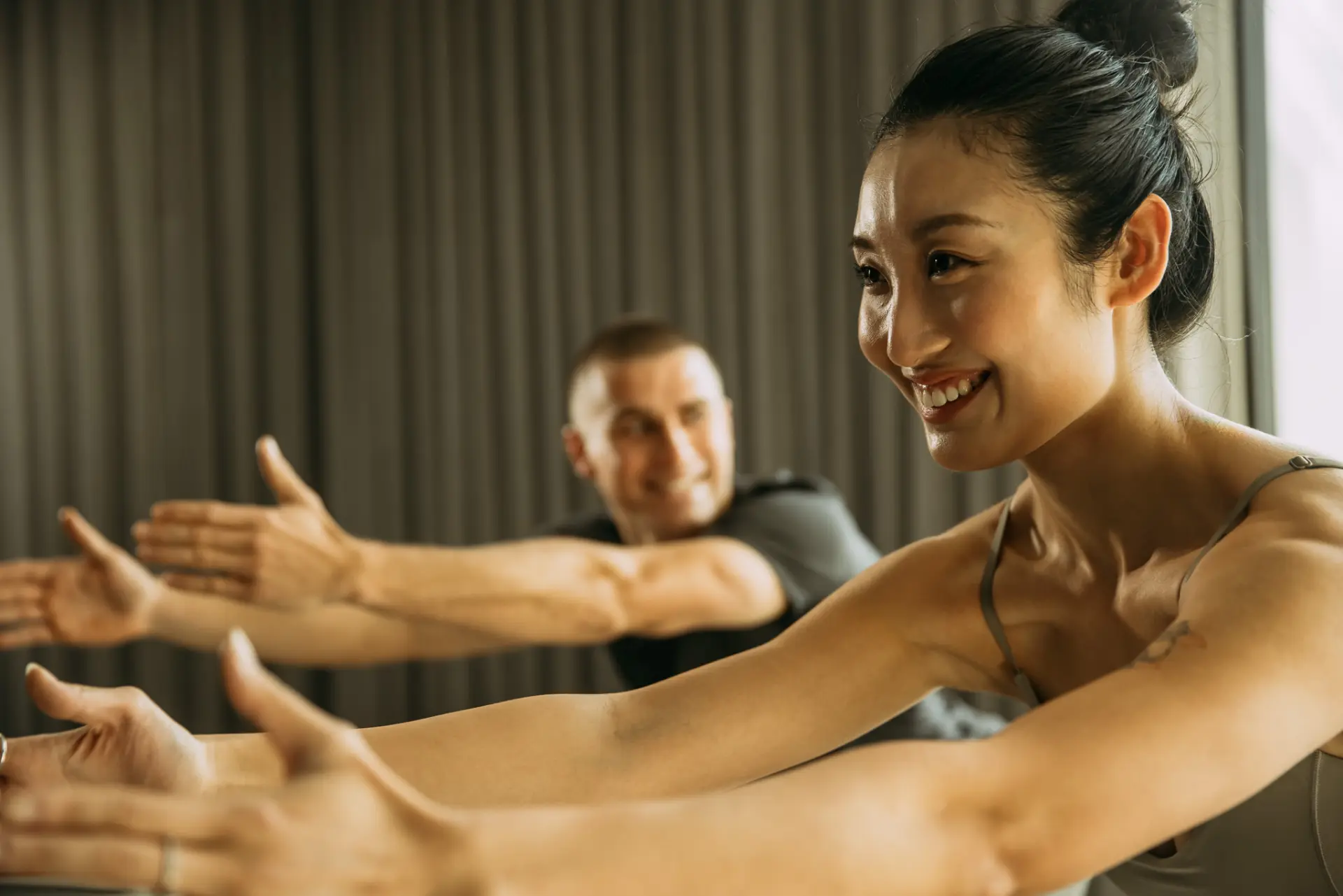 People with arms stretched forward