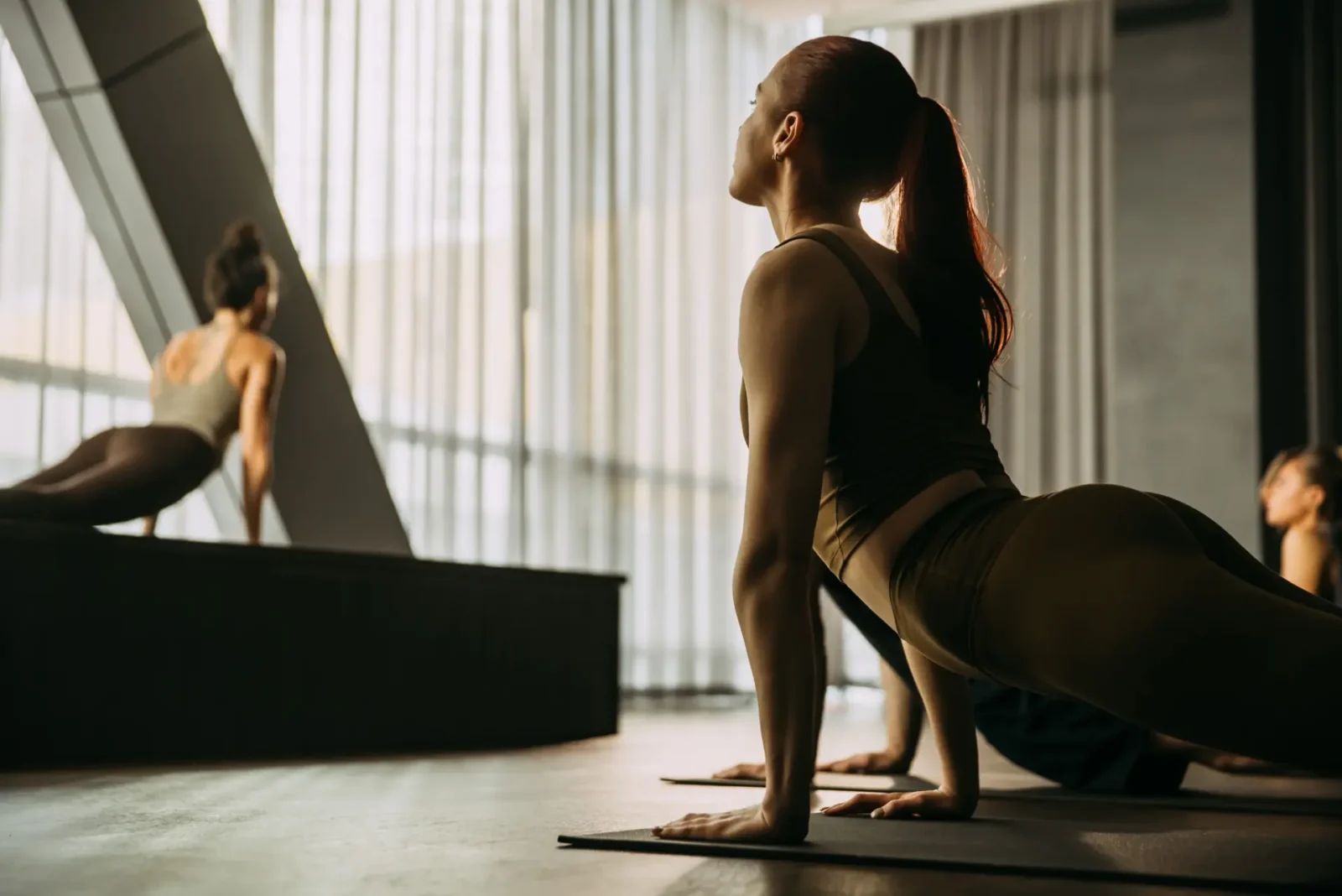 People holding cobra yoga