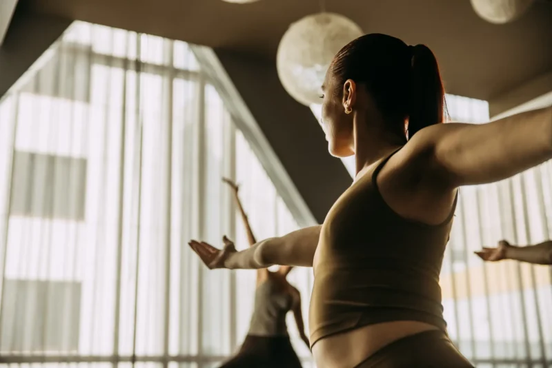 Person stretching arms in yoga