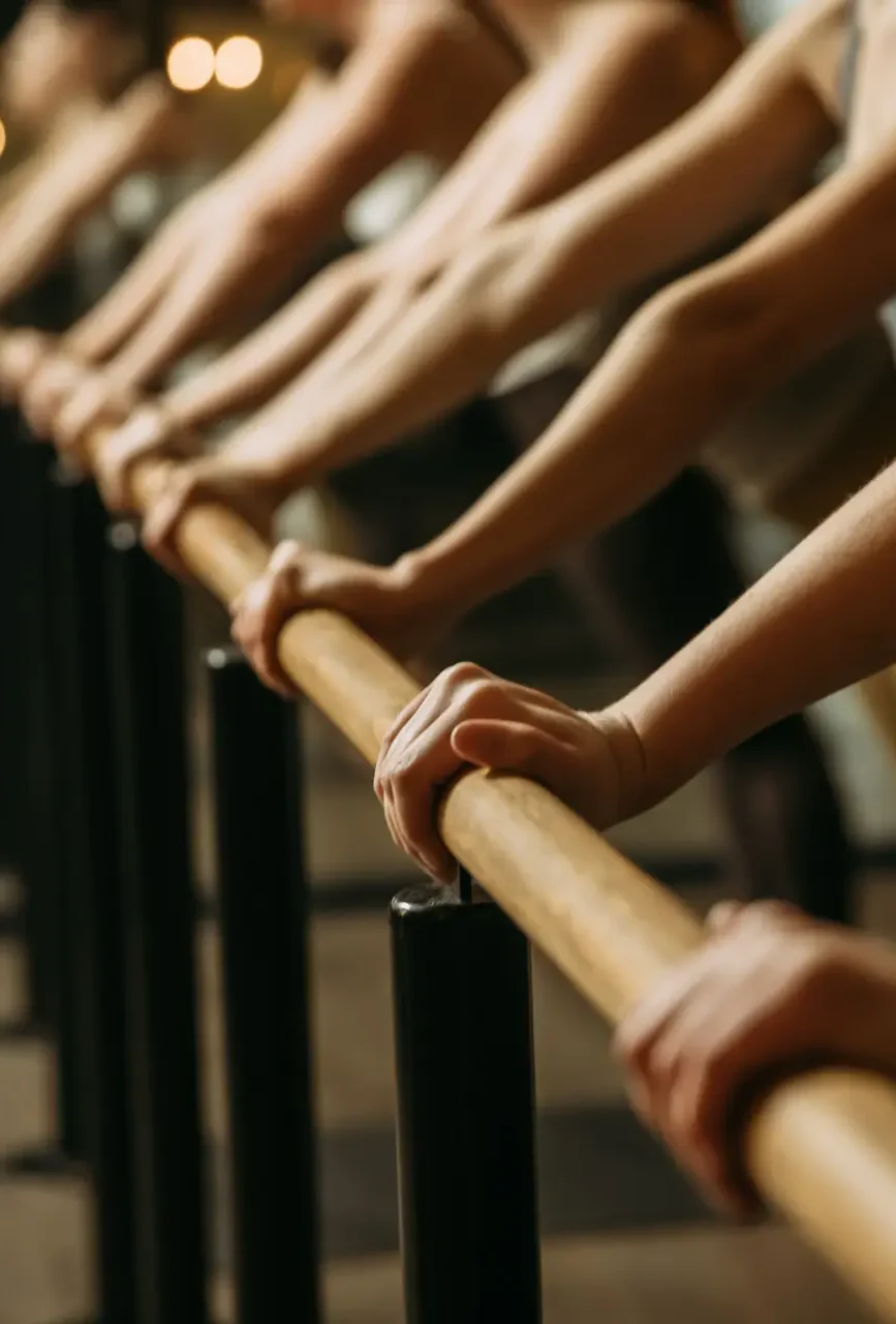 Row of people with arms on bar