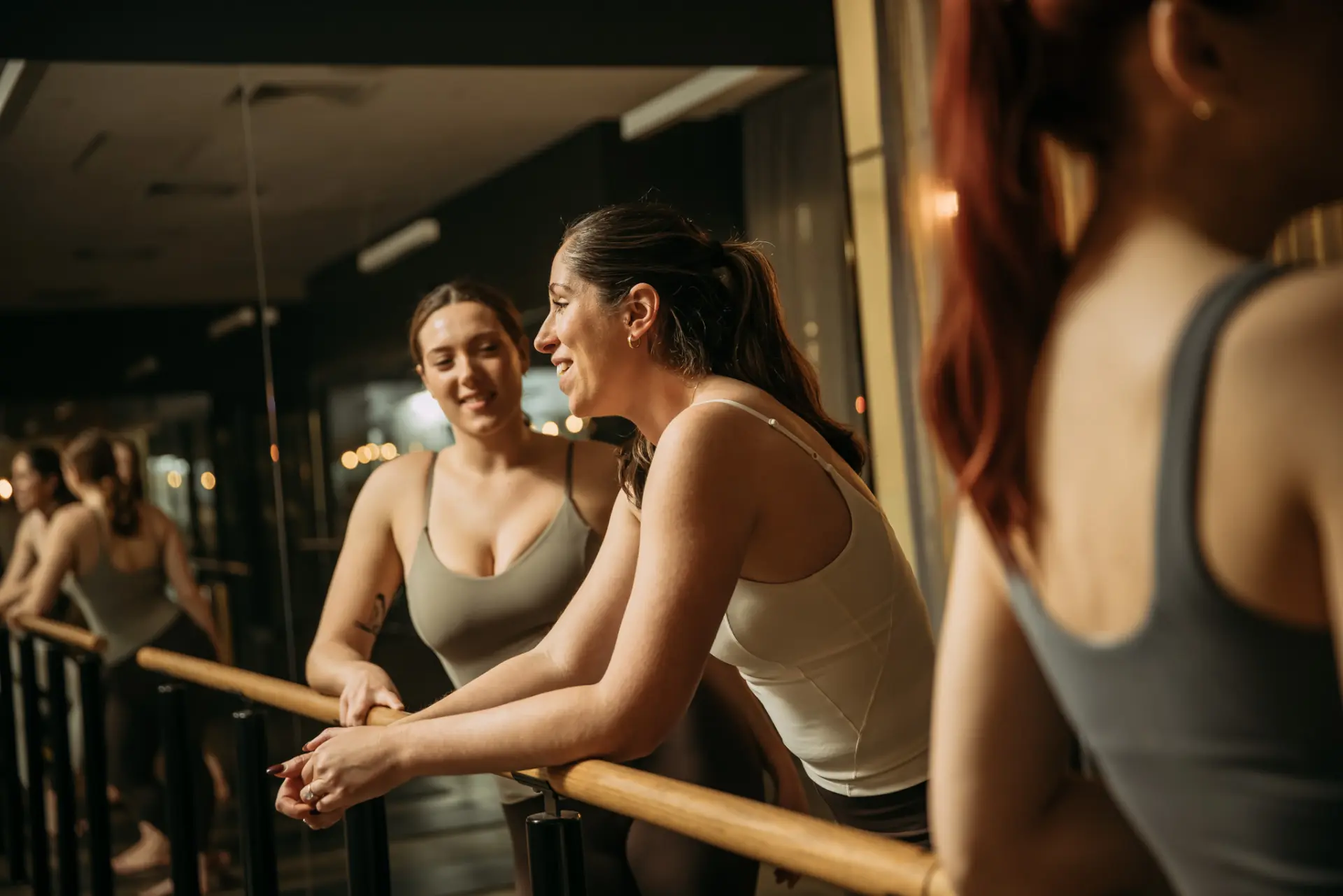 People chatting in barre class