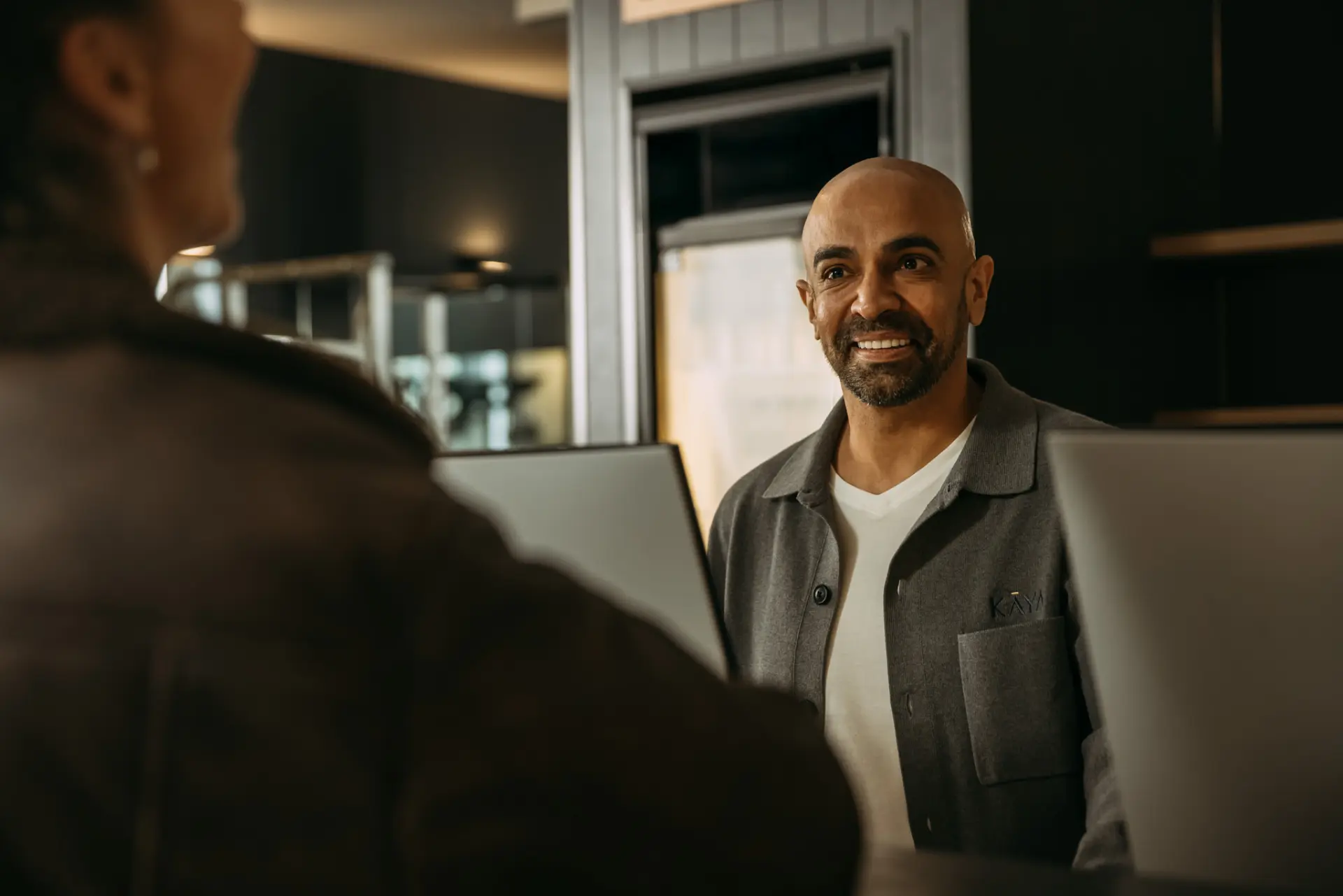 Owner of Kaya at front desk