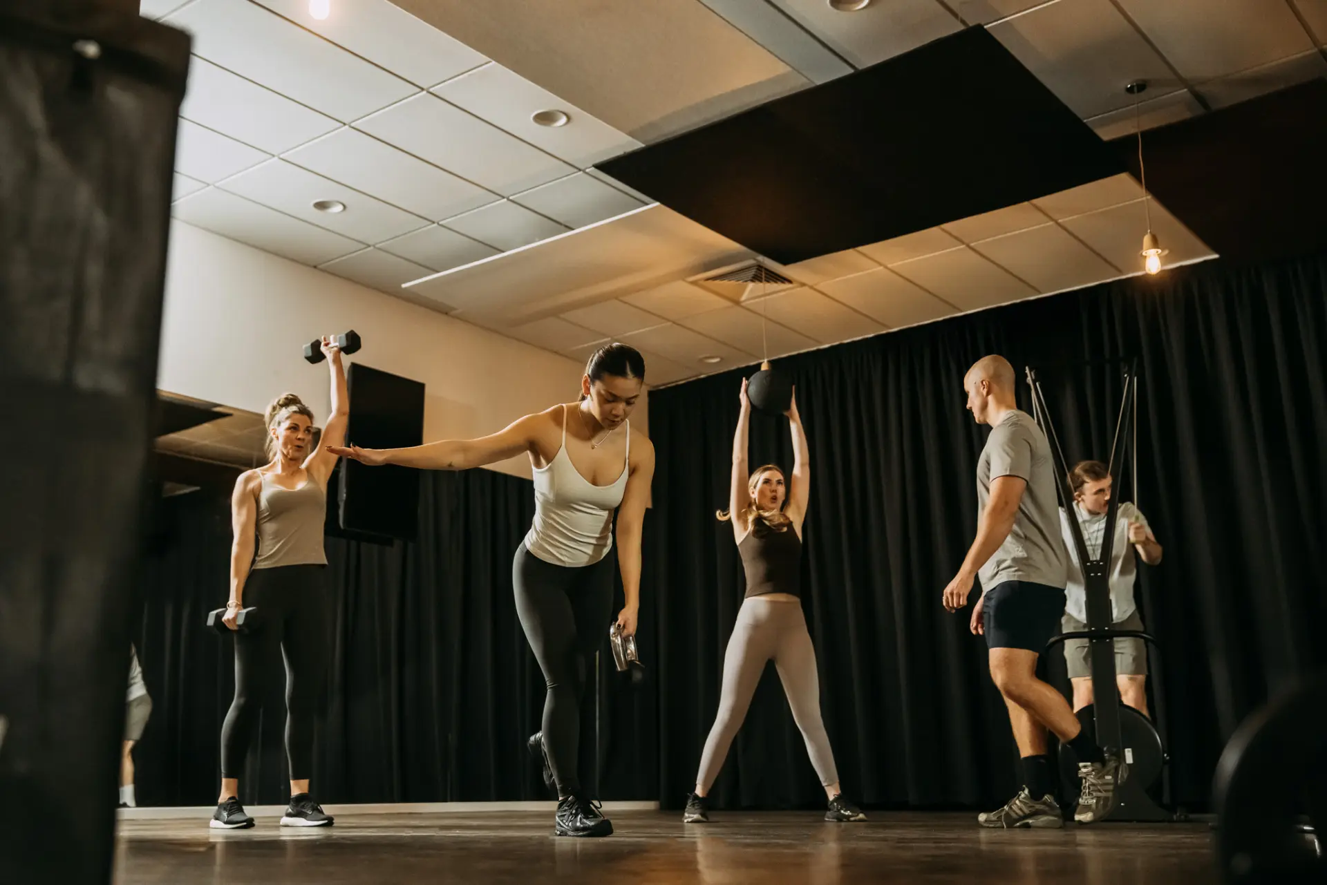 Group of people exercising with weights