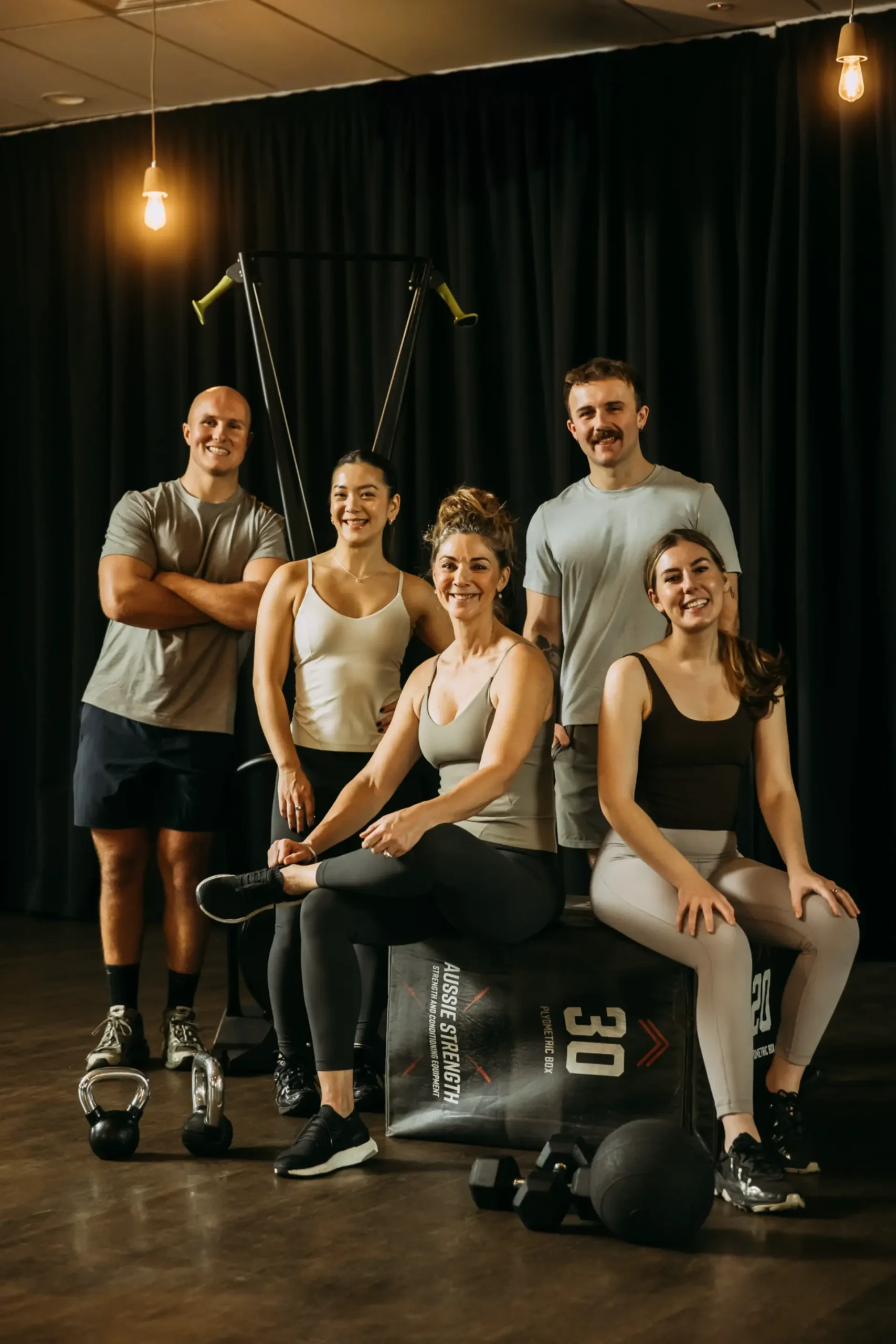 Group photo of members with weight equipment